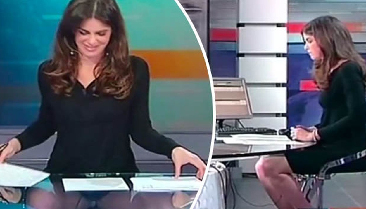 News anchor forgets table is transparent
