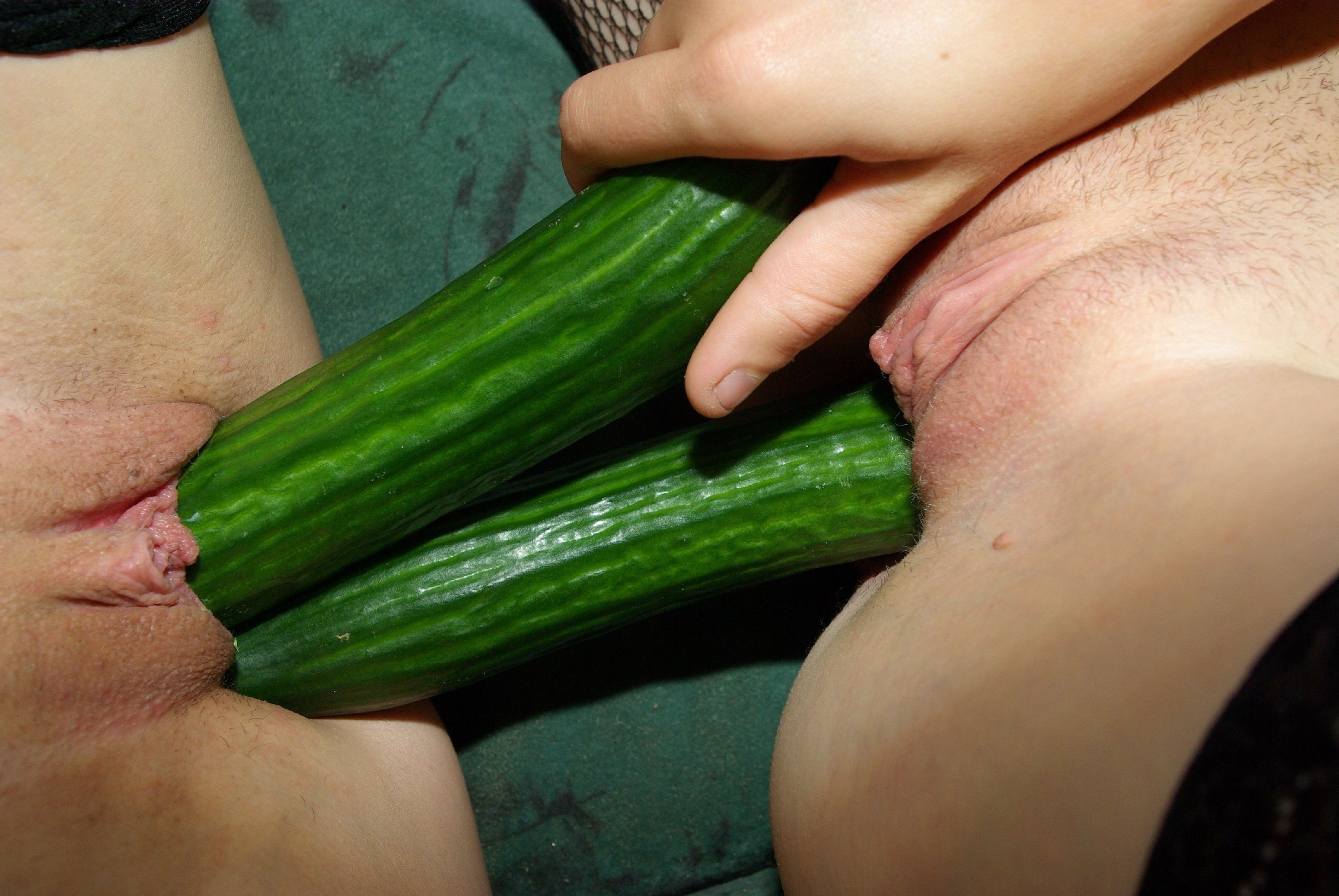Two cucumbers in pussy image