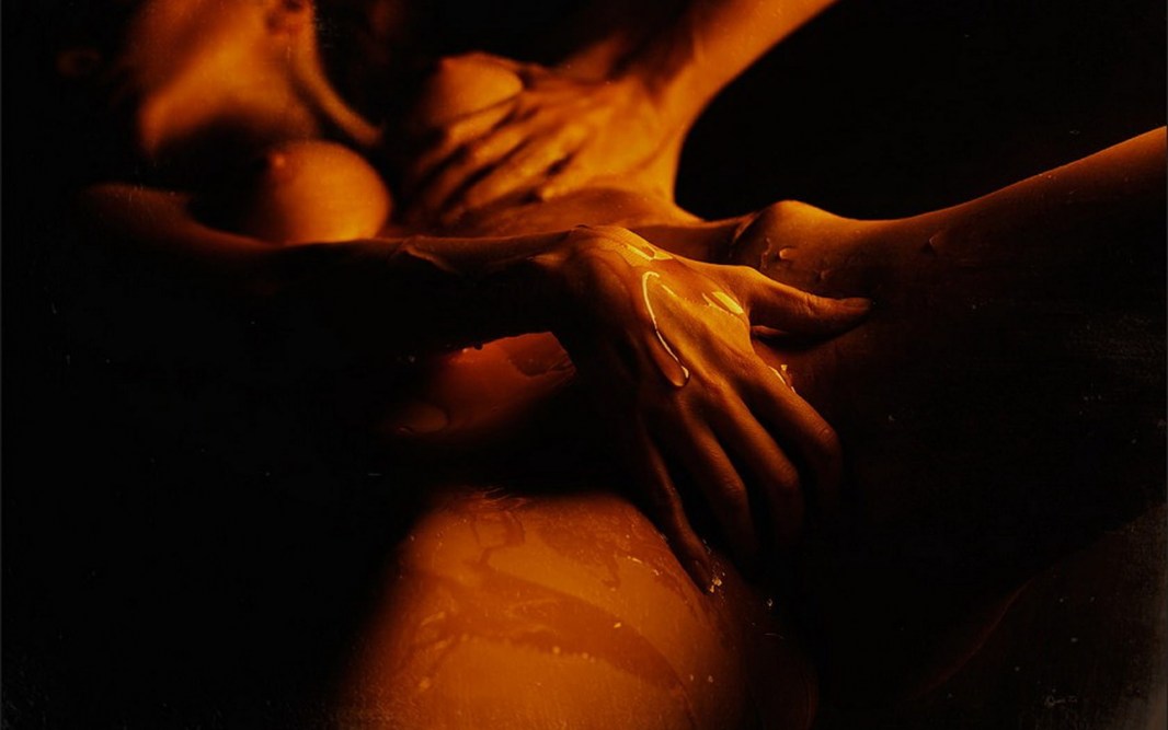 Man gently caresses a woman