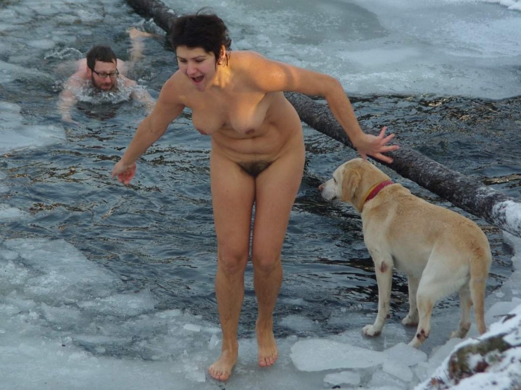 The woman bathes topless