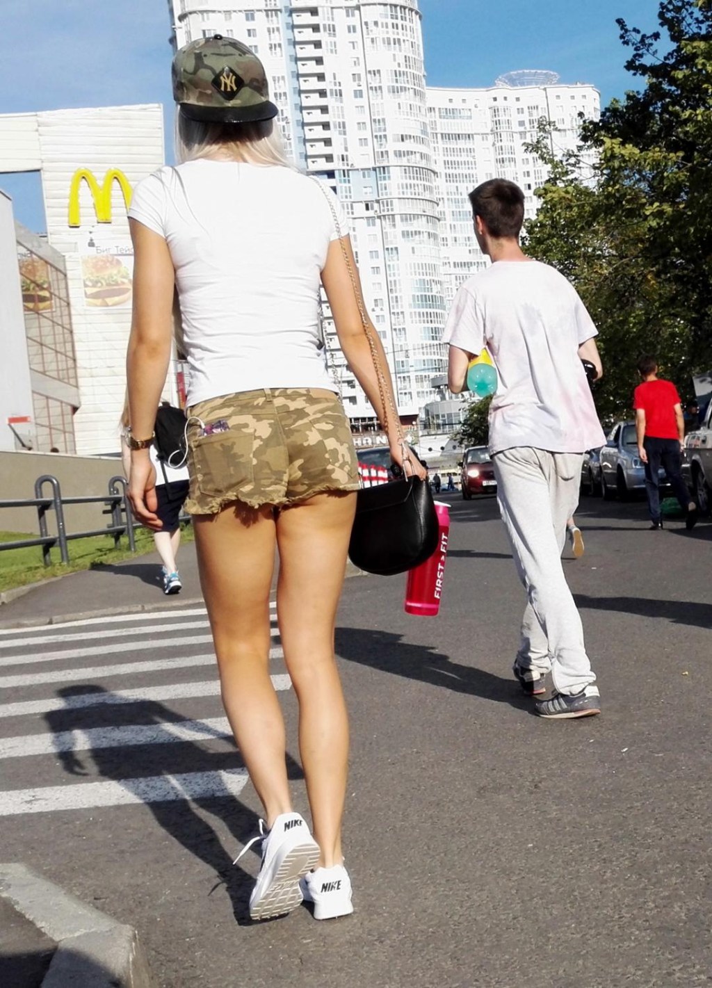 Ultra mini skirt on the street with a cork